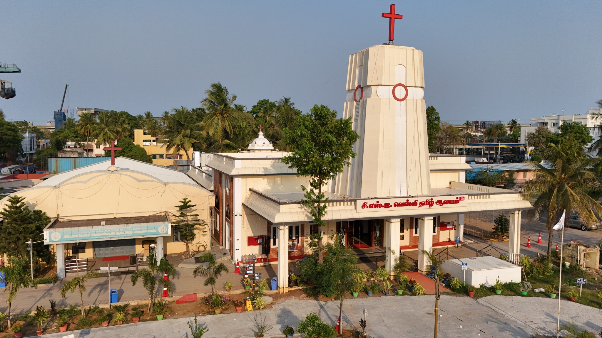 Full daylight aerial view of C.S.I. Wesley Tamil Church and its campus